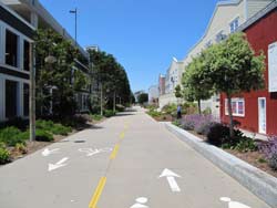 Bike path in Monterey lined with buildings.